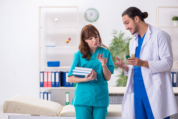 Two doctors colleagues working in the hospital