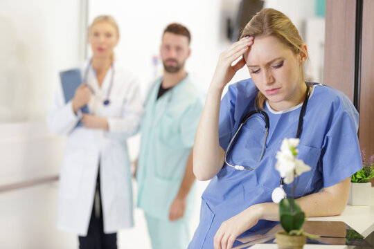 nurse or doctor woman suffering from stress and frustration