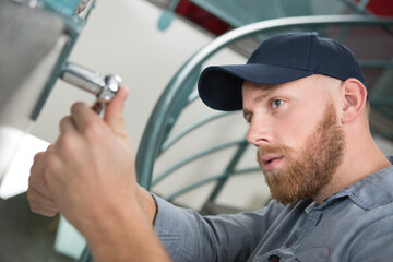 handyman using a socket wrench