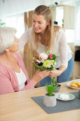 charming blonde lady smiling to her mum