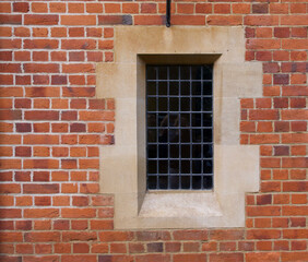 Architectural feature showing old fashioned window embedded in brick wall
