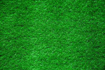 Fototapeta premium Background Abstract Texture Artificial Grass Summer bright Green color on the Surface of the Football Field in the Stadium for Active Games