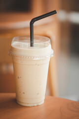 A plastic cup of ice smoothie coffee