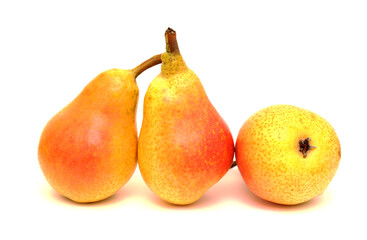 Small red and yellow pears on a black slate board