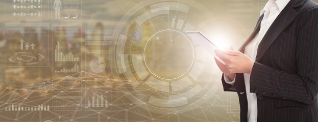 business woman with tablet analyzes data. City background with graphs and charts