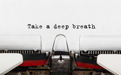 Text Take a deep breath typed on retro typewriter