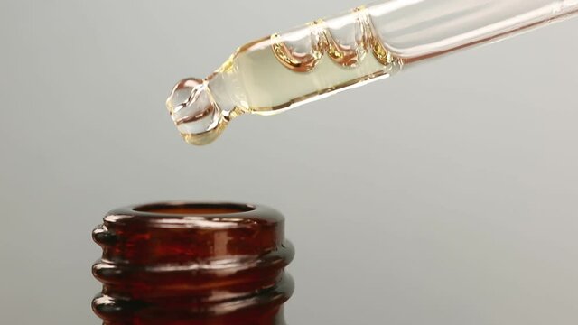 Pipette with essential oil The concept of beauty, skin care, aromatherapy, spa, cosmetology. Close-up, detailed macro photo.
