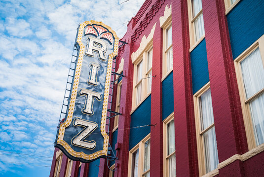 Brunswick, Georgia, United States - July 18 2012: Historic Ritz Theater Sign in Old Town Brunswick on a Red and Blue Brick Facade.