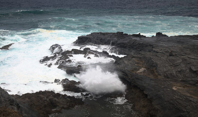 North coast of Gran Canaria, lava fields of Banaderos area, grey textured lava from eruption of Montana de Arucas, 
stormy weather in October
