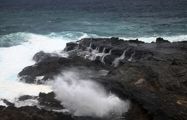 North coast of Gran Canaria, lava fields of Banaderos area, grey textured lava from eruption of Montana de Arucas, 
stormy weather in October