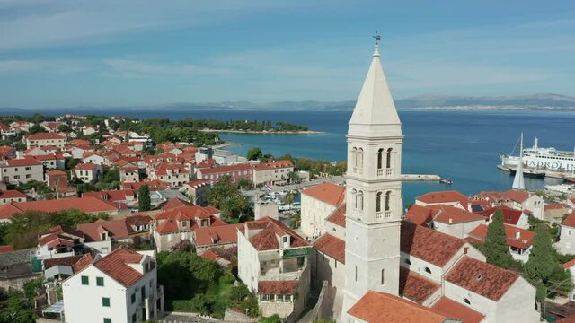 flying clockwise around church tower of Supetar on Brac Island Croatia