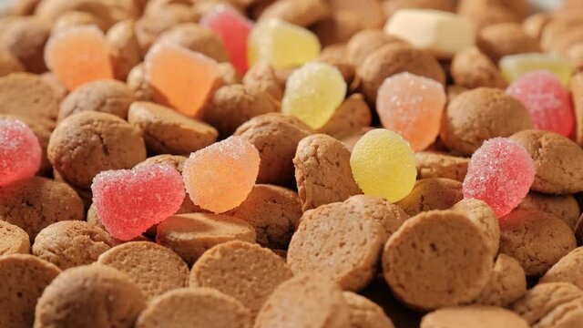 Background for Dutch holiday Sinterklaas. Rotation of kruidnoten, traditional sweets, strooigoed. St. Nicolas day concept. 4K video, 50 fps