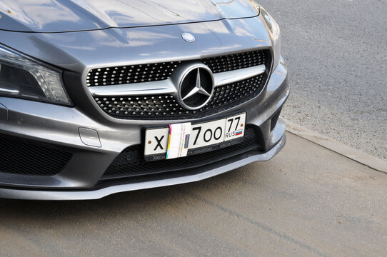 Mercedes car with closed digits on the registration plate in the parking lot