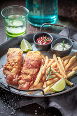Delicious baked potatoes and salmon served with lime and salt