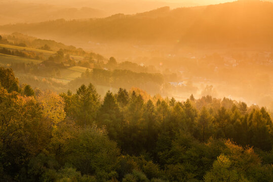 Warm Sunlight at Sunrise in Autumn. Polish Countryside Landscape at Fall Season