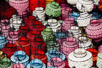 Traditional chinese lanterns in bright colors standing on a foor at a flea market, Beijing, China