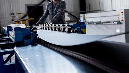 Metal sheet forming machine at the modern metalwork factory.