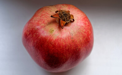 ripe pomegranate on a white background