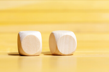 Two simple blank wooden dice, pair of plain cubes with logo or icon space, double cube mockup design with two letter or logos copyspace