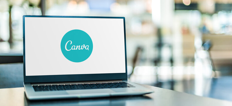 Laptop computer displaying logo of Canva