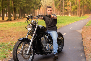 Beautiful young man on a motorcycle