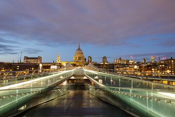 St. Paul Cathedral from the illuminated Millennium Bridge ramp during nightfall