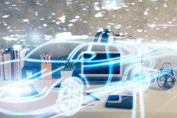 Desktop computer background in office with automobile hologram drawing. Multi exposure. Tech concept.