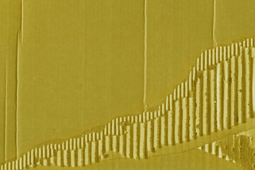 A yellow vintage rough sheet of carton. Recycled environmentally friendly cardboard paper texture. Simple and bright minimalist papercraft background.
