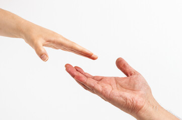 Women's hand goes to the man's hand on white background