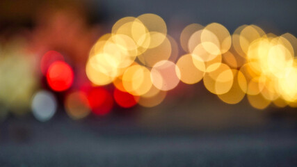 defocused blur bokeh of city lights at night abstract background
