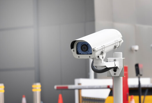 Modern Public CCTV Camera At Gantry Entry Parking Lot. Recording Cameras For Monitoring All Day And Night. Concept Of Surveillance And Monitoring With Copy Space.