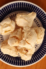 Breakfast, with starch biscuit, cheese bread, served on a wooden table outdoors. Farm breakfast. Coffee, coffee strainer on the table.