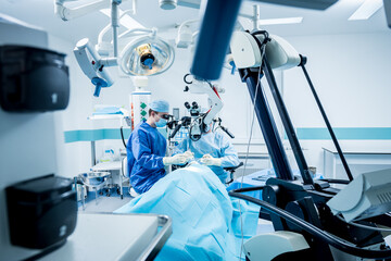A team of surgeons performing brain surgery to remove a tumor.