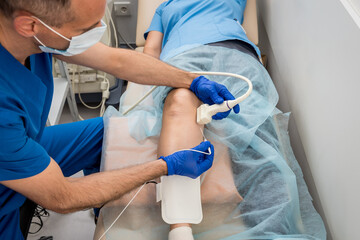Cardiologist use tubes and ultrasound for radiofrequency catheter ablation.