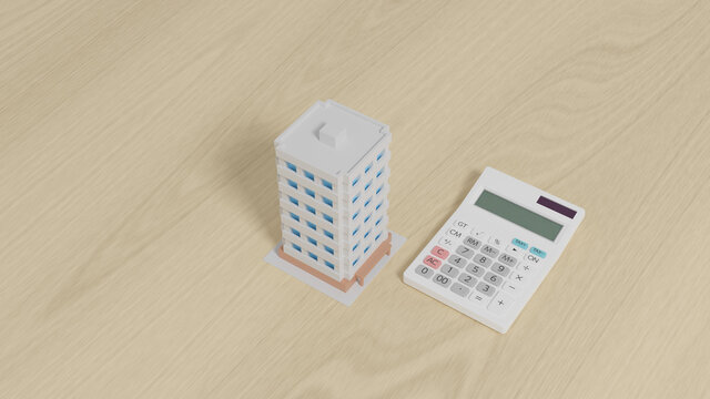 Calculator with a toy apartment placed on a plane.