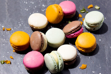 Macarons on a dark gray slate