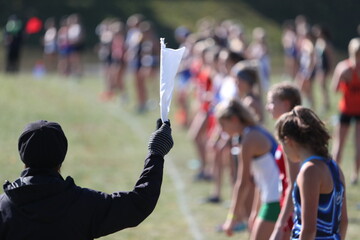 A girls high school cross country race is about to start.