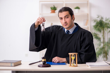 Young male judge in time management concept