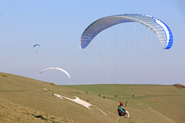 Paragliders flying at Milk Hill, Wiltshire	