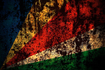 Seychelles, Seychellois flag on grunge metal background texture with scratches and cracks