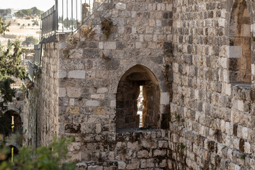 Fototapeta na wymiar Fragment of the city wall near the Zion Gate in the old city of Jerusalem, Israel