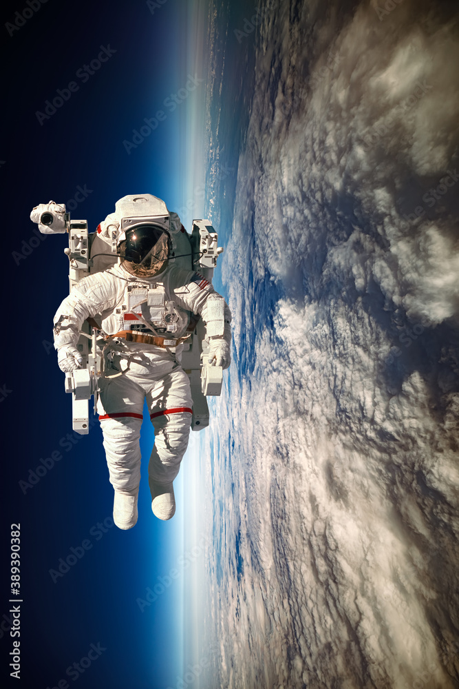 Wall mural astronaut in outer space against the backdrop of the planet earth. elements of this image furnished 
