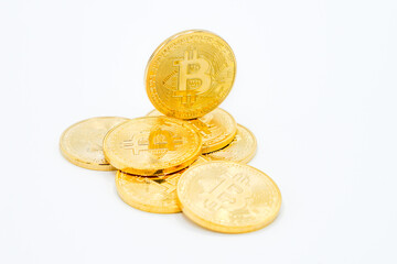 New virtual money: Golden bitcoin coin on a white Background. The future Cryptocurrency. Business and Trading concept.