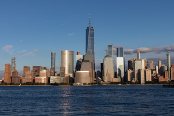 Naklejka premium Lower Manhattan Skyline along the Hudson River in New York City before Sunset