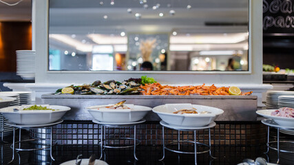 Fresh green mussel and shrimps in seafood on ice buffet bar