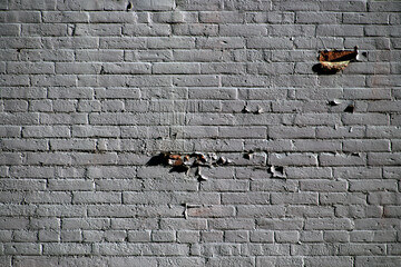 Faded painted brick wall