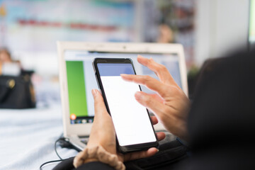 Hands Teacher using application smartphone at computer desktop in training technology coding for Developing program to manage teaching learn in classroom university. E-learning education online