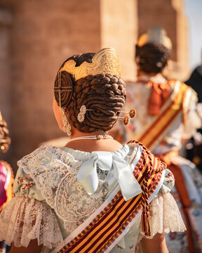Young woman using a traditional fallera custom in Valencia - Falleras de valencia is a famous tradition celebrated every year