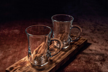 Empty glass cup for Turkish tea (armudu) with a handle on a dastarkhan