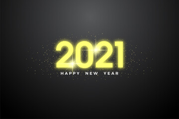 Happy new year 2021 with elegant yellow glowing numbers.
